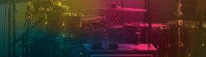 Drum kit on stage with colorful lighting