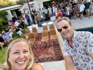 Large group selfie at backyard pool party