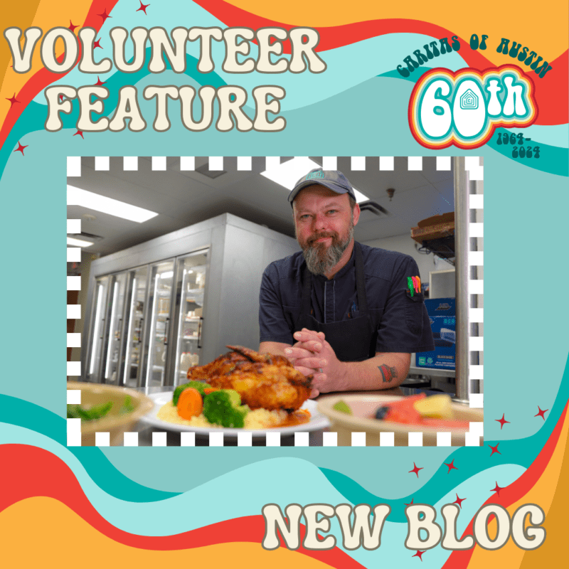 Volunteer chef posing with roasted chicken in kitchen