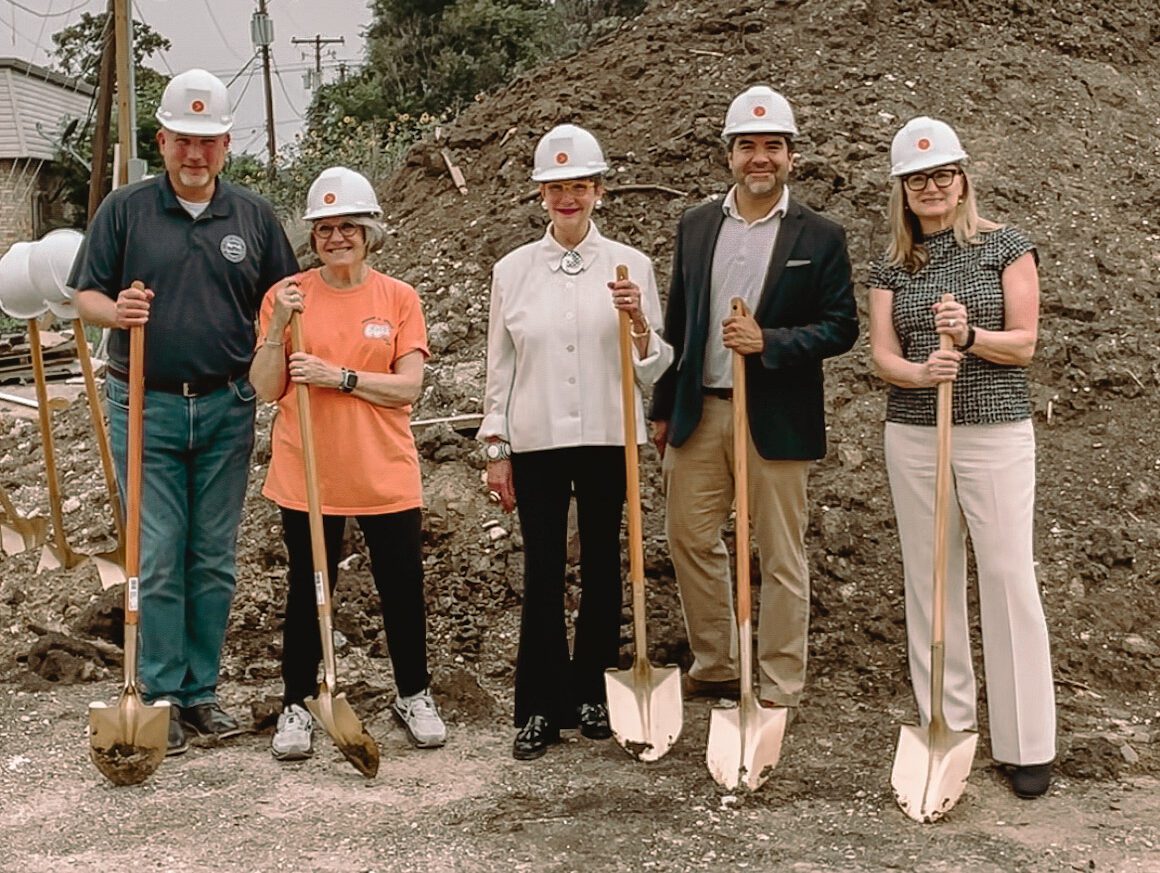 Groundbreaking ceremony with shovels and hard hats