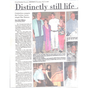 Newspaper page with headline and group photos
