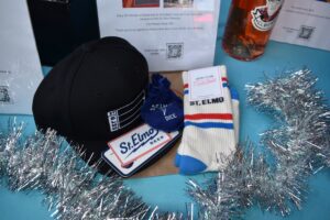 St. Elmo hat, socks, and branded merchandise