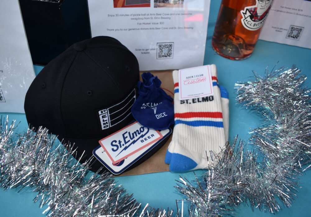 St. Elmo hat, socks, and branded merchandise