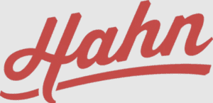 Red cursive "Hahn" logo with swoosh