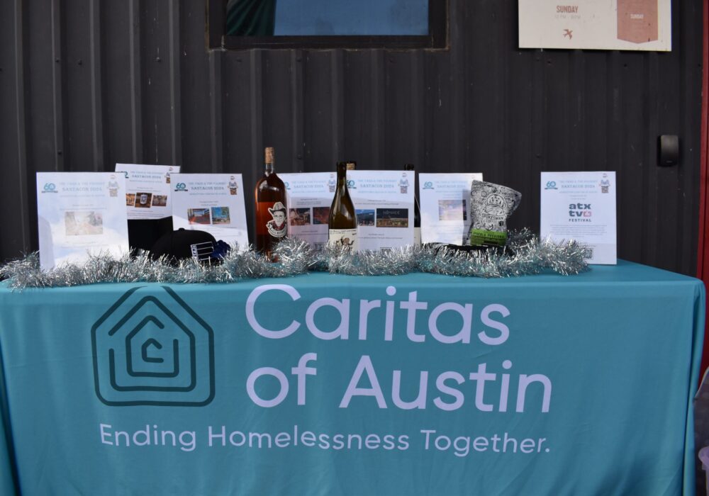 Caritas of Austin informational table with brochures